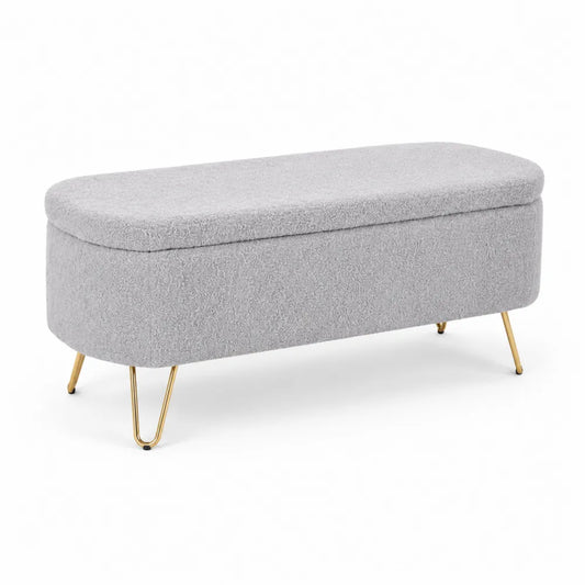 Panca contenitore in tessuto bouclé grigio con gambe in metallo dorato